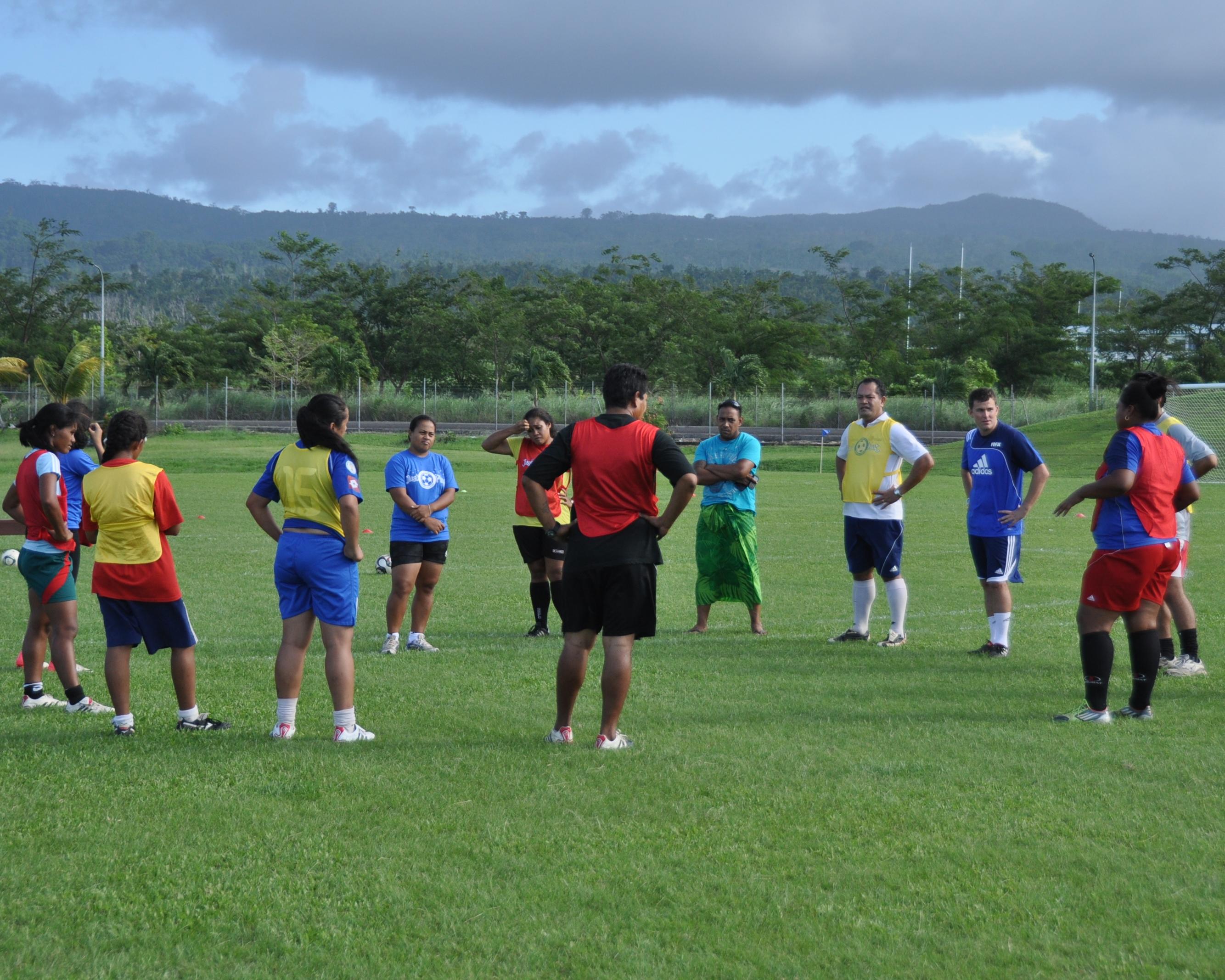 A Projects Abroad volunteer prepares a group for practice during his rugby coaching work experience in Samoa. A group prepares for a practice during volunteer rugby coaching experience in Samoa.